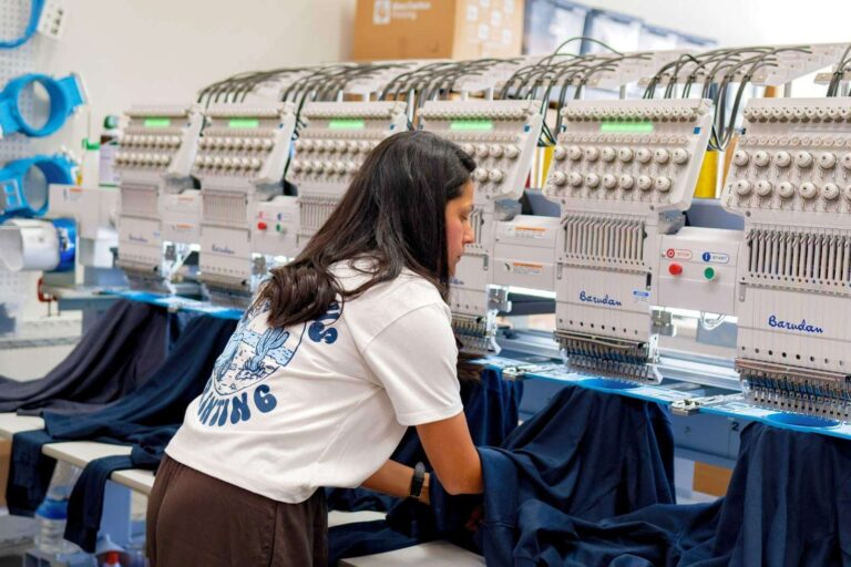 Close-up photo of high-quality custom embroidery on a navy polo shirt created by Blue Cactus Printing in Los Angeles, showcasing clean stitching and professional logo detail.